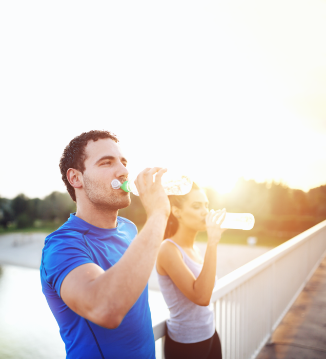 man and woman drinking water