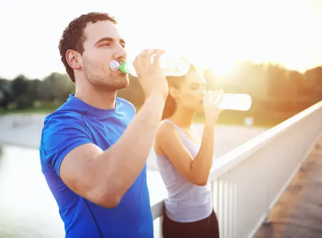 man and woman drinking trying to achieve their keto diet nutrition goals man and woman drinking trying to achieve their keto diet nutrition goals